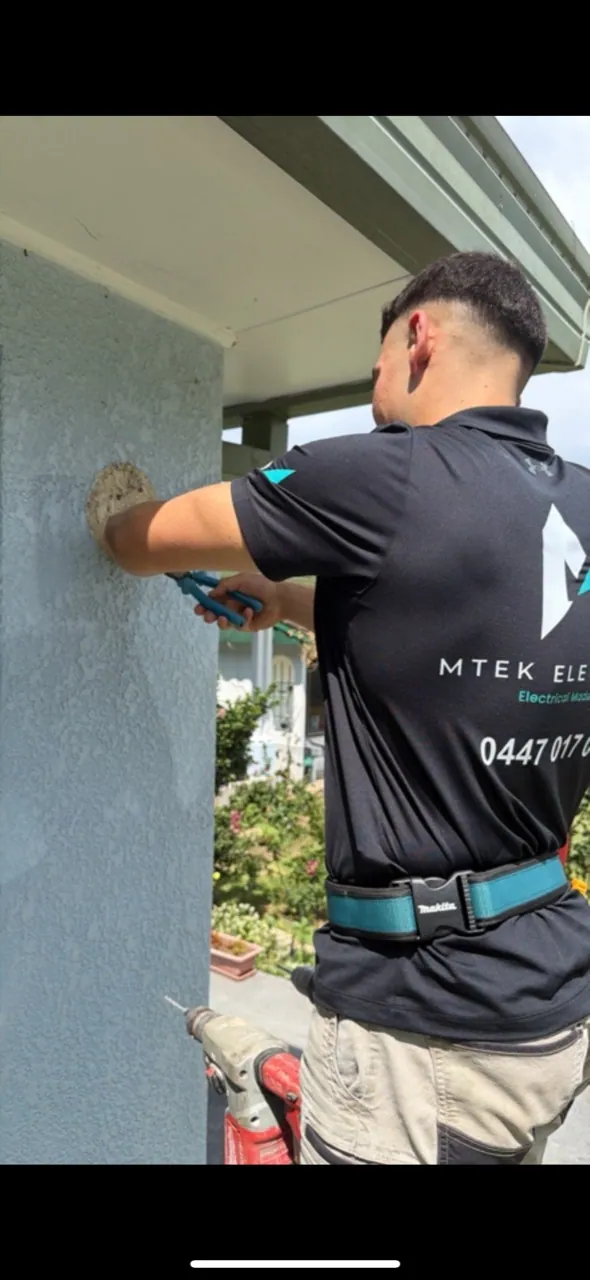 MTEK electrician carrying out electrical work at a customer’s home